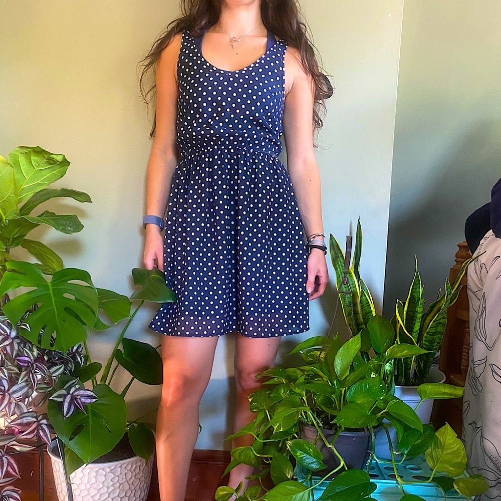 Navy blue polka-dot dress with cinched wai…